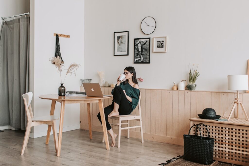 girl drinks coffee and relaxes, seems to leverage stress to work calmly and focus