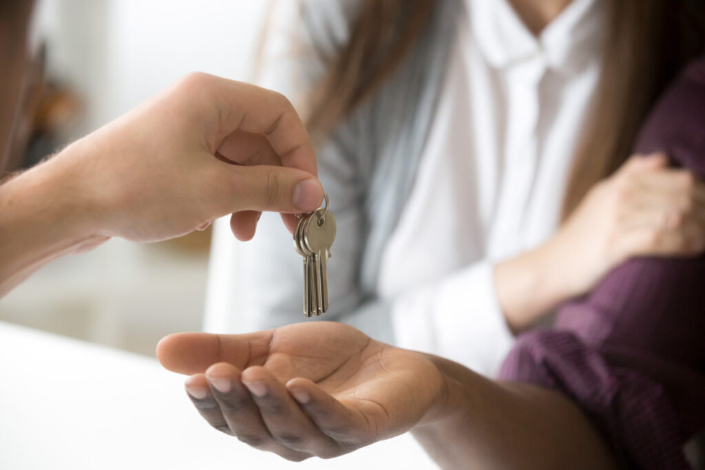 property manager handing over the keys to a home